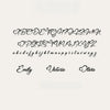 Black cursive alphabet font sample showing uppercase, lowercase, and personalized names on a light beige background.