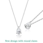 Silver necklace with teardrop-shaped diamond pendants on a white background