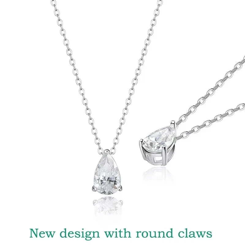 Silver necklace with teardrop-shaped diamond pendants on a white background