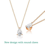 Rose gold necklace with teardrop-shaped clear gemstones on a white background