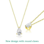 Gold necklaces with teardrop-shaped clear stones on a white background