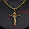 Gold crucifix pendant with chain on a black background, showing measurements.