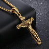 Gold crucifix pendant on a black background